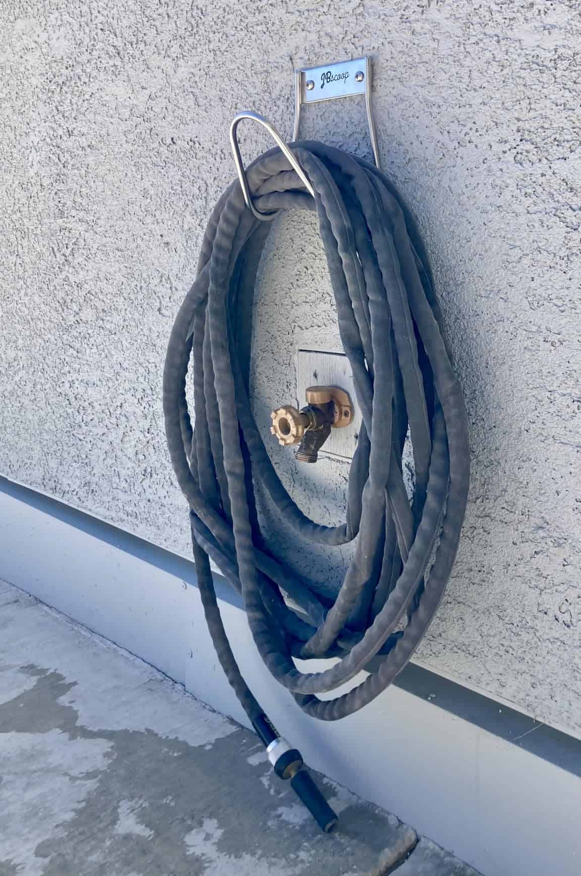 garden hose holder SS with black water hose