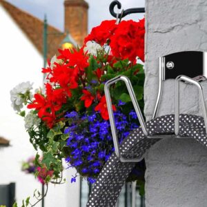 Outdoor hose storage mounted on a wall for outdoor use