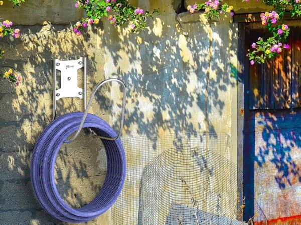 Hose holder wall mount mounted on a wall for outdoor use lare